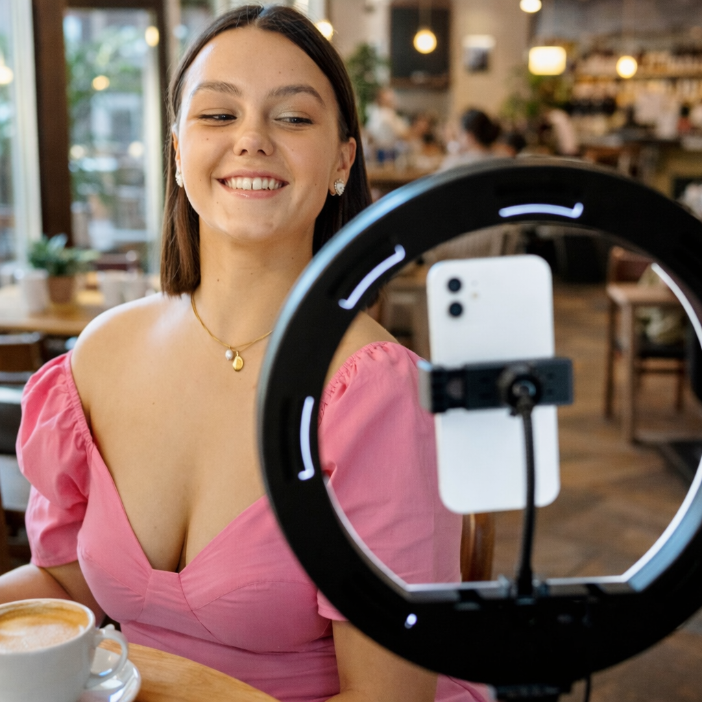 Content Creator filming in a cafe location after booking through Craetor Spots