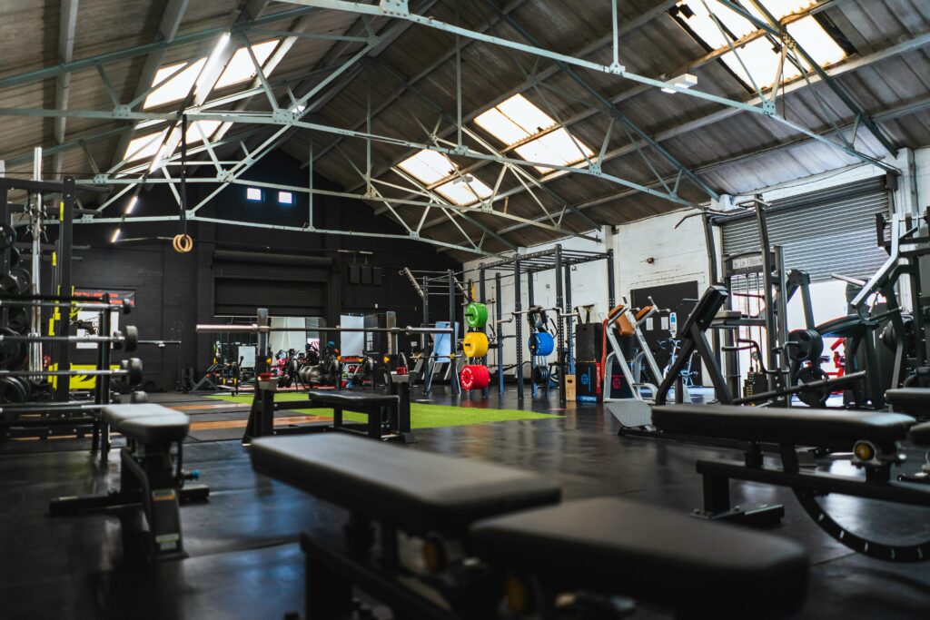 empty industrial gym interior with high skylights and equipment suitable for content creator hire