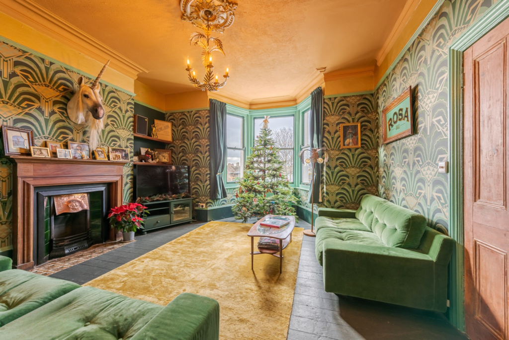 Eclectic living room with bay window, chandelier and art deco wallpaper at Margate Delight photography location Margate