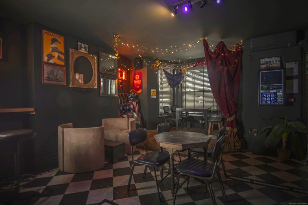 basement bar at The Albion Rooms Margate with booth seating and checkerboard floor, hireable as a podcast recording space