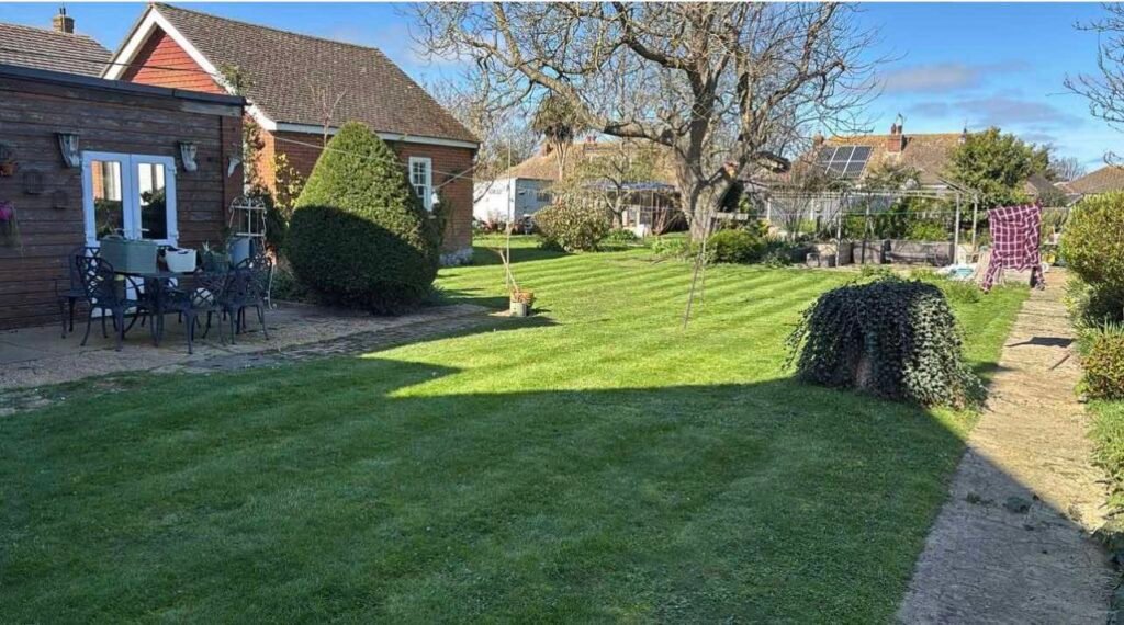 Private lawned garden with hedging in Victorian villa Margate
