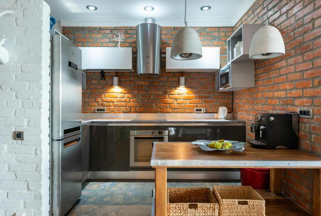 Holiday let kitchen with exposed brick set up for UGC content creation in Kent