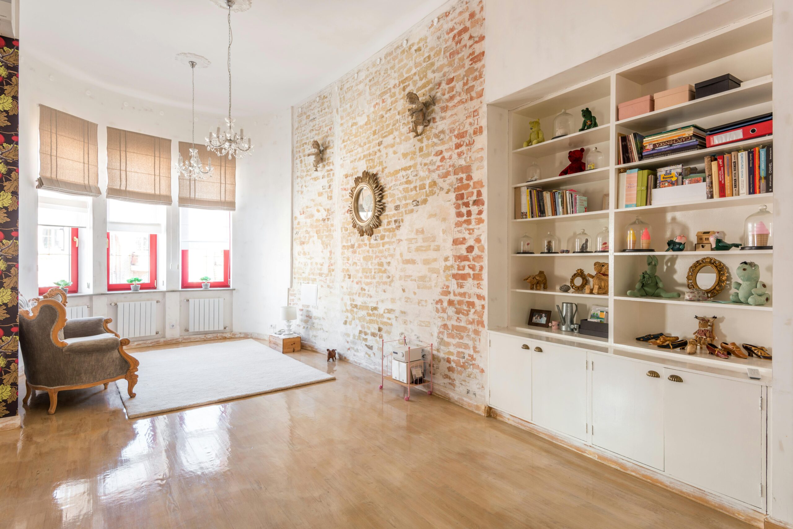 Natural light living room with exposed brickwork and polished wooden flooring in a house in Thanet, Kent