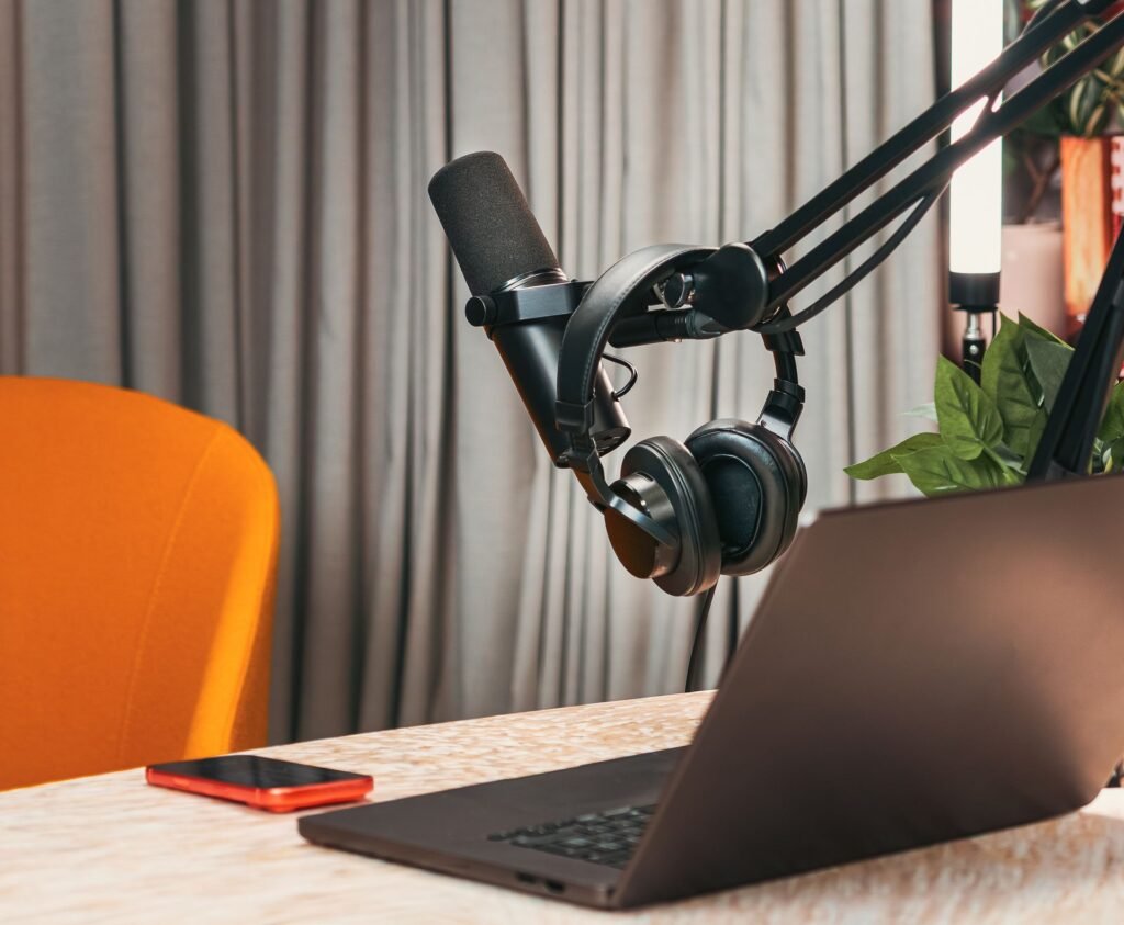 podcast microphone in a furnished room with soft seating, the kind of acoustics that suit hired podcast spaces in Kent