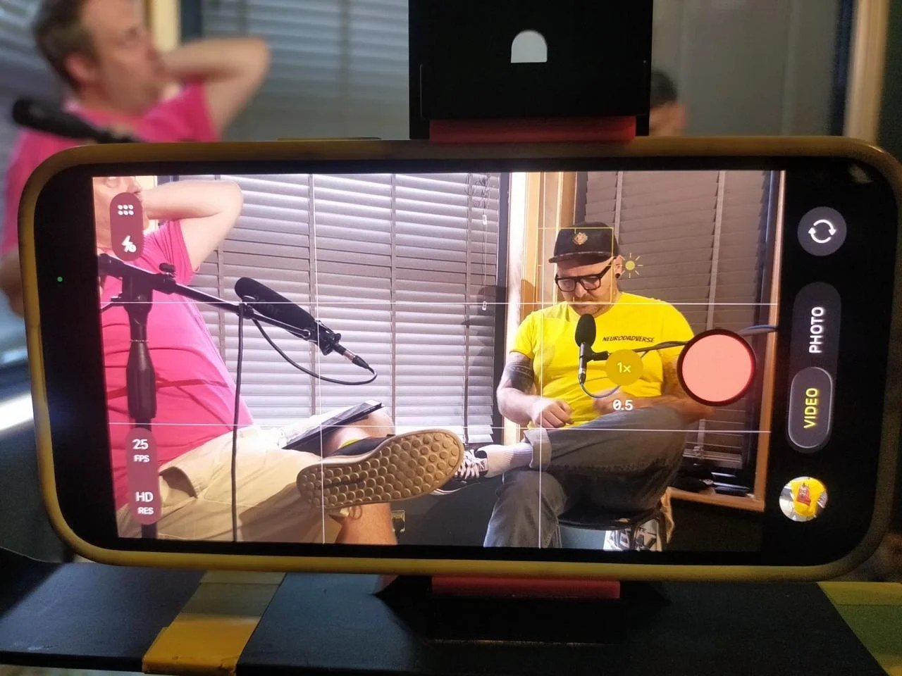Smartphone screen showing Danny Eycott and Benny Whimsy-Qualms framed during the NeuroDADverse recording
