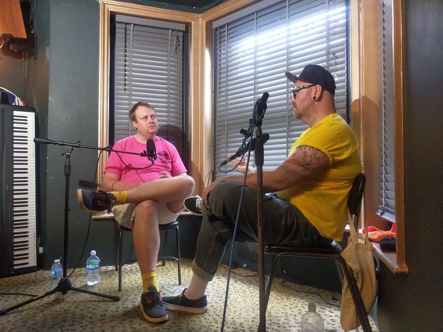 Two microphones on stands positioned for the NeuroDADverse hosts during the video podcast recording