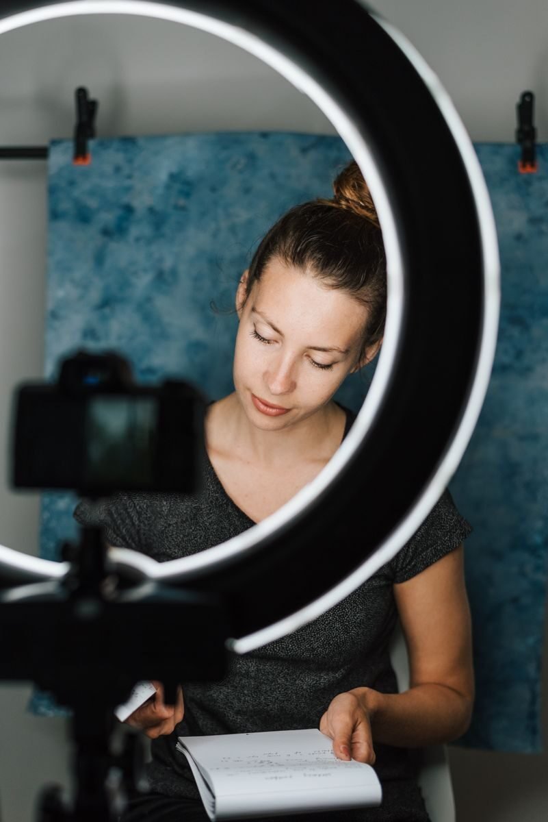Content creator reviewing a brand brief and shot list before a shoot