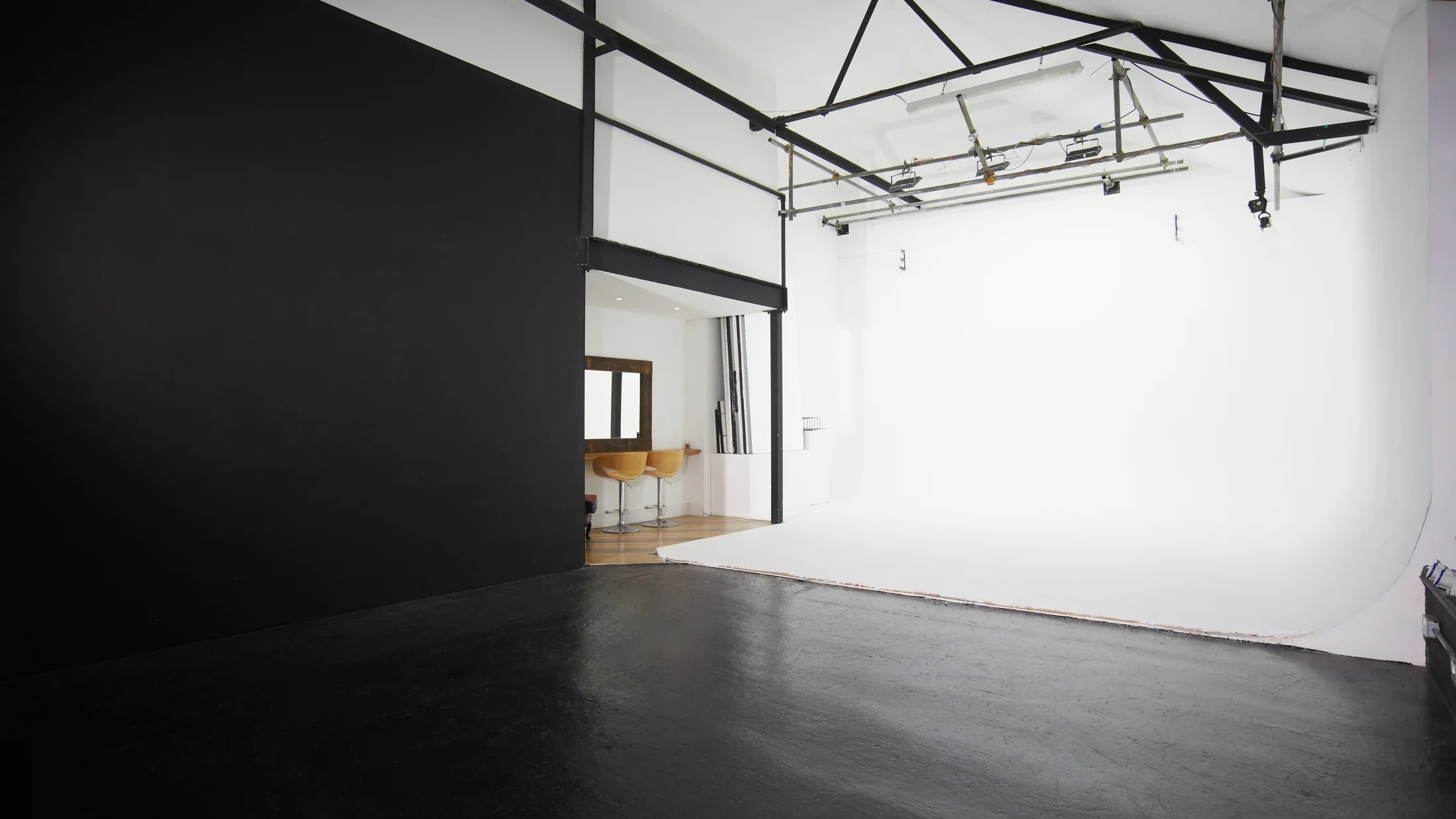 Wide view of Fire Eye Land's white infinity cove and overhead lighting rig