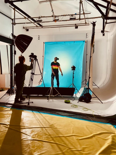 Photography shoot in progress on Fire Eye Land's infinity cove with cameras and studio lighting